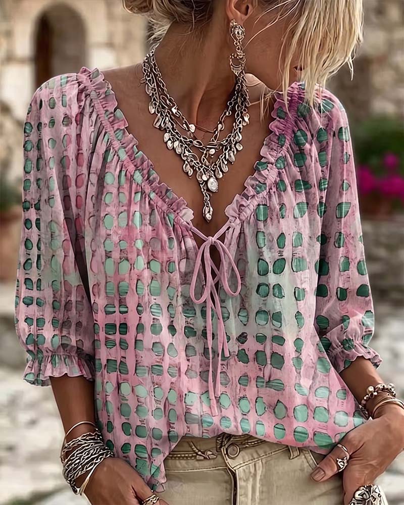 Blusa de mujer con volantes y lazo en el escote