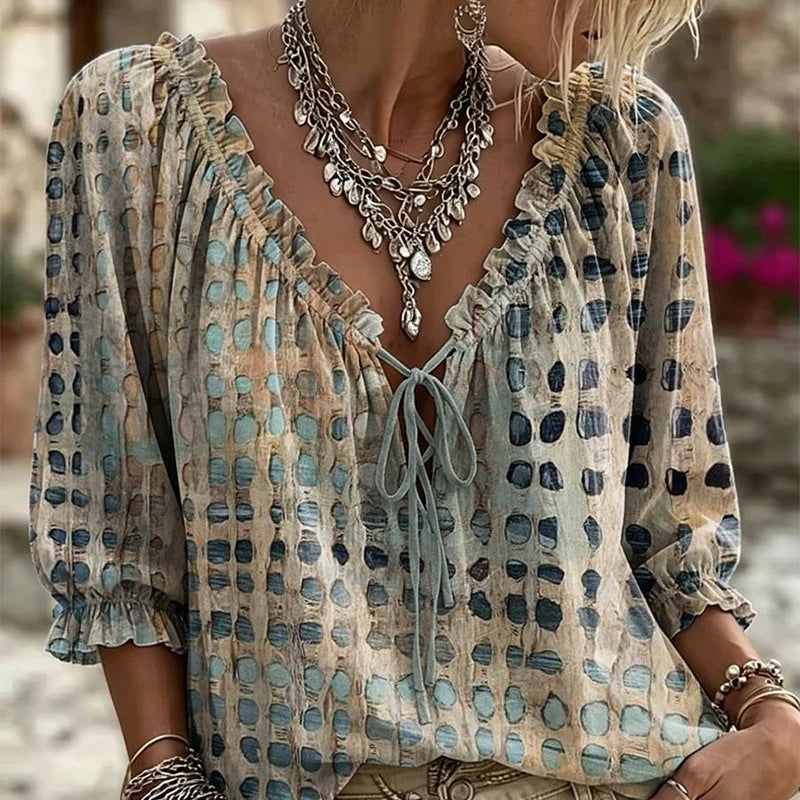 Blusa de mujer con volantes y lazo en el escote